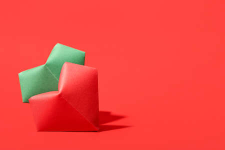 Origami hearts on color backgroundの写真素材