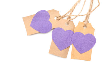 Shopping tags with paper hearts on white backgroundの写真素材
