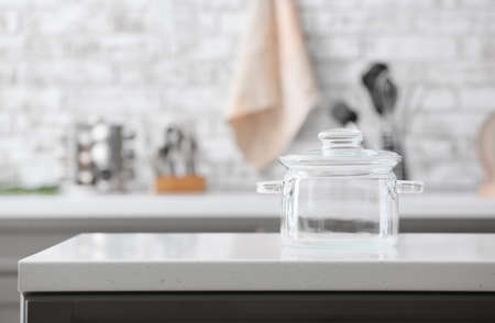 Stylish cooking pot on counter in kitchenの写真素材