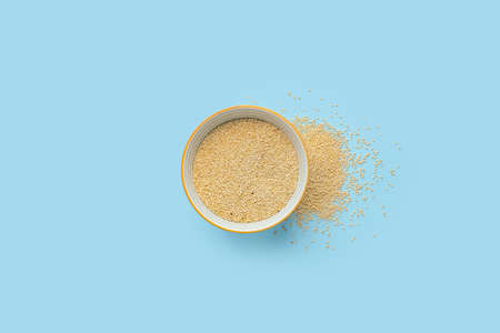 Bowl with healthy quinoa on color backgroundの写真素材