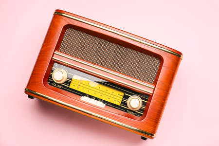 Vintage radio receiver on color backgroundの写真素材