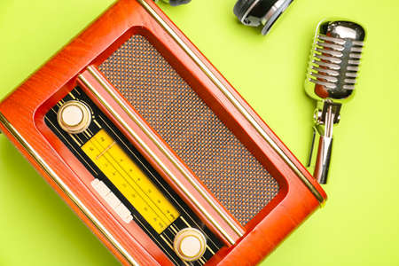 Retro radio receiver with microphone on color backgroundの写真素材