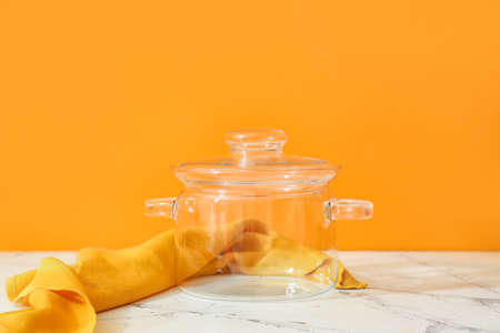 Stylish cooking pot on color backgroundの写真素材