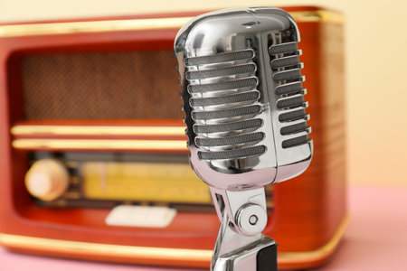Microphone with retro radio receiver on color background, closeupの写真素材