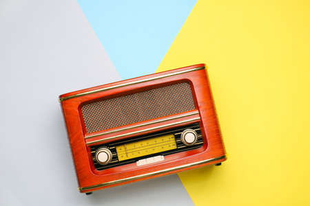Vintage radio receiver on color backgroundの写真素材