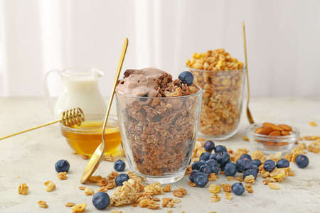Composition with tasty granola on tableの写真素材