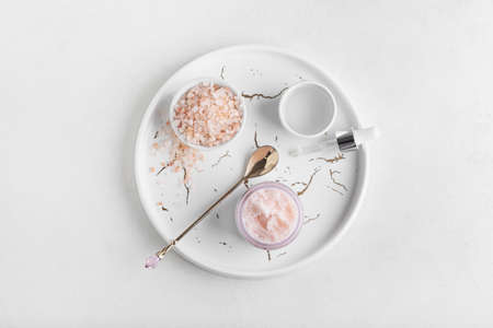 Tray with natural scrub and ingredients on white backgroundの写真素材
