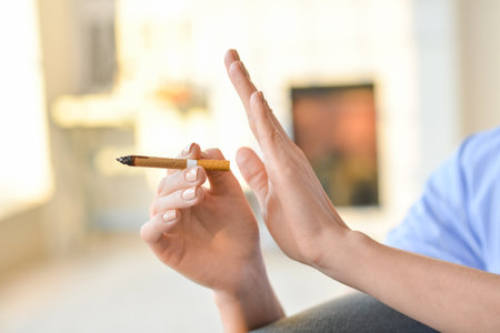 Young woman rejecting cigarette, closeup. Concept of refusing from bad habitの写真素材