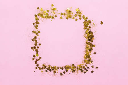 Frame made of confetti on color backgroundの写真素材