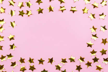 Frame made of confetti on color backgroundの写真素材