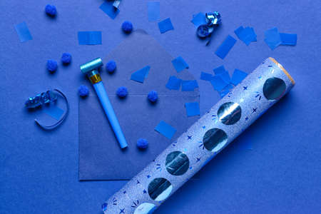Party set with confetti and envelope on color backgroundの写真素材