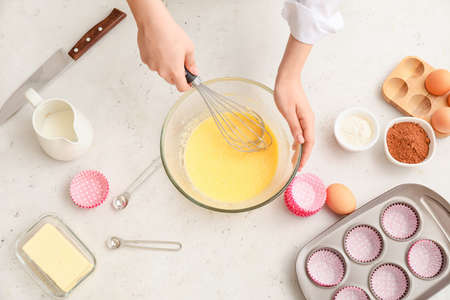 Woman preparing pastry in kitchenの写真素材