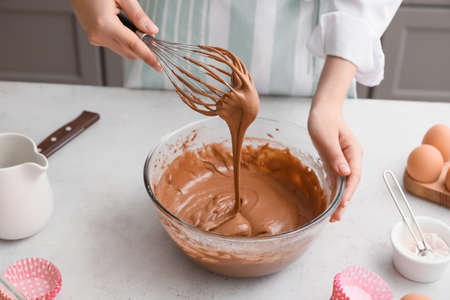 Woman preparing pastry in kitchenの写真素材