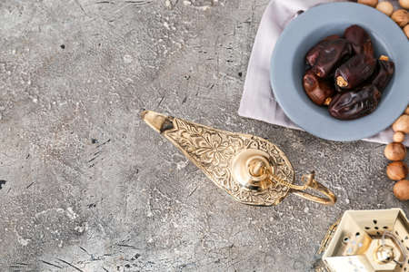 Aladdin lamp of wishes and dates on grunge backgroundの写真素材