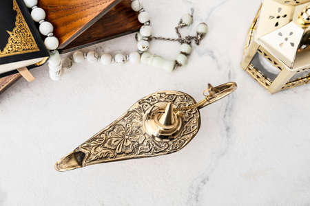 Aladdin lamp of wishes on light backgroundの写真素材