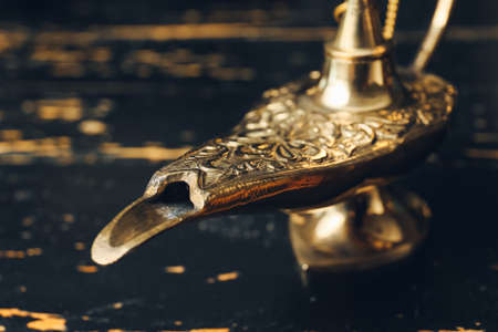 Aladdin lamp of wishes on dark wooden background, closeupの写真素材