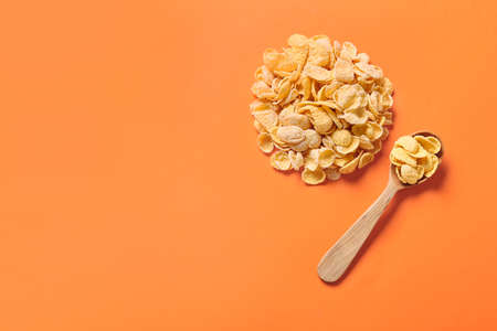 Tasty cornflakes on color background
