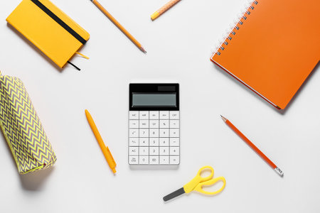 Modern calculator and stationery on white backgroundの写真素材