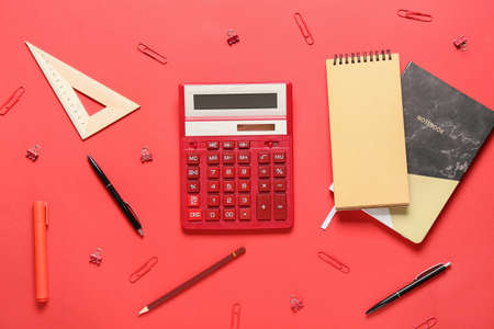 Modern calculator and stationery on color backgroundの写真素材