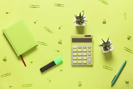 Modern calculator and stationery on color backgroundの写真素材