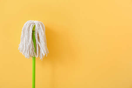 Floor mop on color background