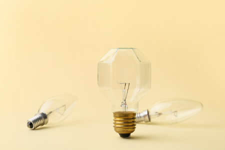 Light bulbs on color background