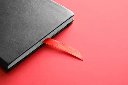Book with bookmark on color backgroundの写真素材