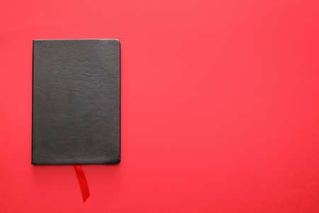 Book with bookmark on color backgroundの写真素材