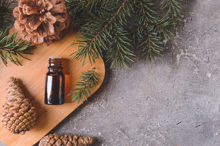 Bottle of coniferous essential oil on grunge backgroundの写真素材
