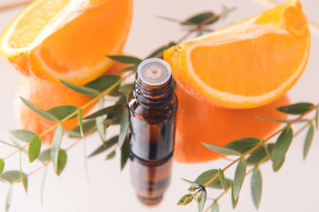 Tray with bottle of citrus essential oil, closeupの写真素材