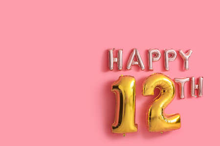 Text HAPPY 12TH made of air balloons on pink background