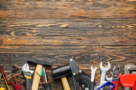 Set of tools on wooden background