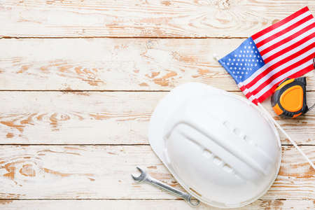 Set of tools and USA flag on wooden background. Labor Day celebrationの写真素材