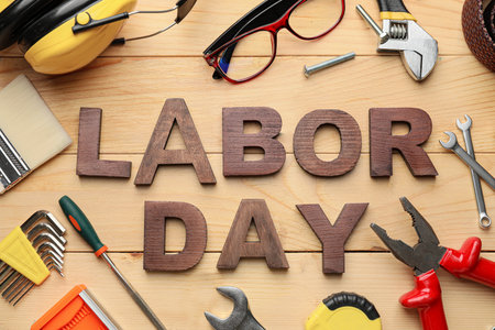 Set of tools and text LABOR DAY on wooden backgroundの写真素材