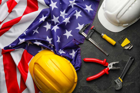 Set of tools and USA flag on dark background. Labor Day celebrationの写真素材