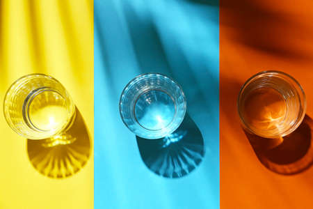 Glasses of water on color backgroundの写真素材