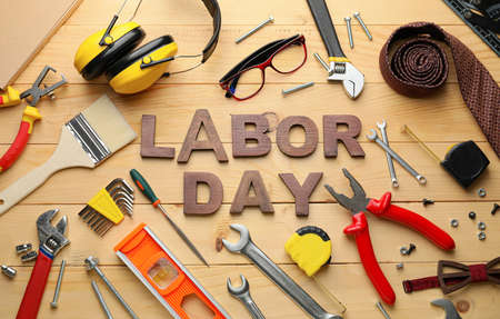 Set of tools and text LABOR DAY on wooden backgroundの写真素材