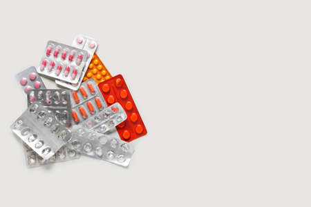 Different pills on white background