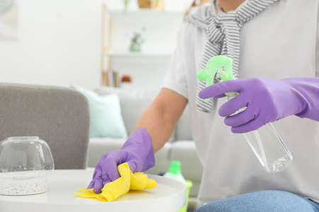 Young man cleaning his flat