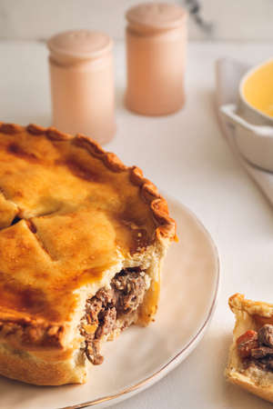Tasty beef pot pie on table
