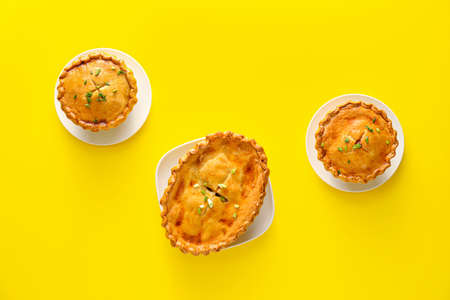 Tasty beef pot pies on color backgroundの写真素材