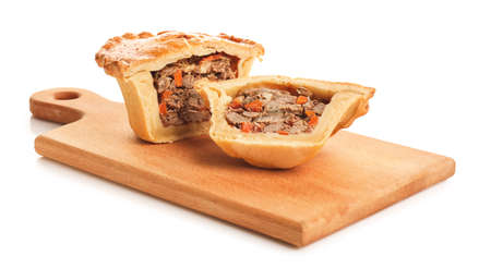 Board with tasty beef pot pie on white background