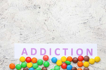 Sweet candies on light background. Concept of addictionの写真素材