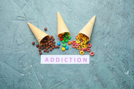 Different sweets on color background. Concept of addictionの写真素材