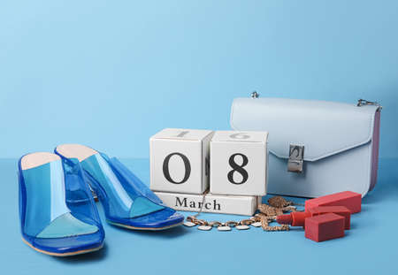 Calendar and stylish accessories on color background. International Women's Day celebrationの写真素材