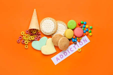 Different sweets on color background. Concept of addictionの写真素材