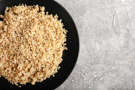 Plate with tasty quinoa on gray backgroundの写真素材