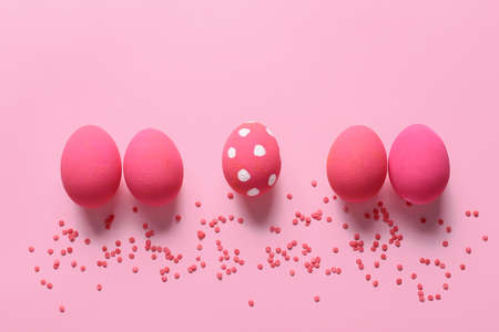 Beautiful Easter eggs on color backgroundの写真素材