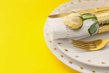 Beautiful table setting on color backgroundの写真素材