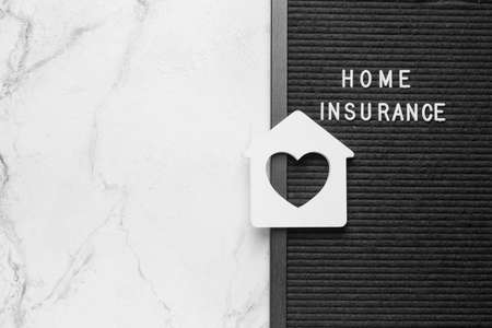 Composition with text HOME INSURANCE on light backgroundの写真素材